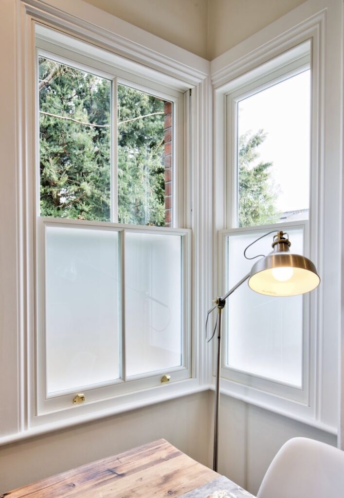 Modern white framed windows with privacy frosted lower panes