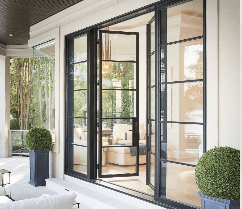 Modern black steel patio doors connecting indoor and outdoor spaces
